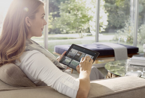 woman on couch with savant ipad