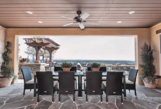 Open-air room overlooking the ocean with Sonance in-ceiling speakers.